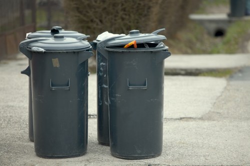 Builders performing waste clearance on a construction site in Wimbledon