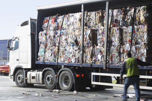 Waste collection trucks operating in Wimbledon neighborhood