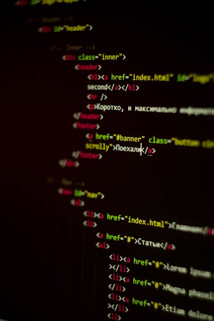 The image depicts a close-up view of a computer screen displaying lines of HTML code, with multicolored tags in shades of green, red, pink, and white against a dark background. The code includes vario